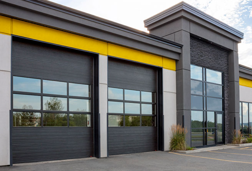 An experienced technician performing commercial garage door repair in Orlando, FL, showcasing tools and parts for quick and efficient service.