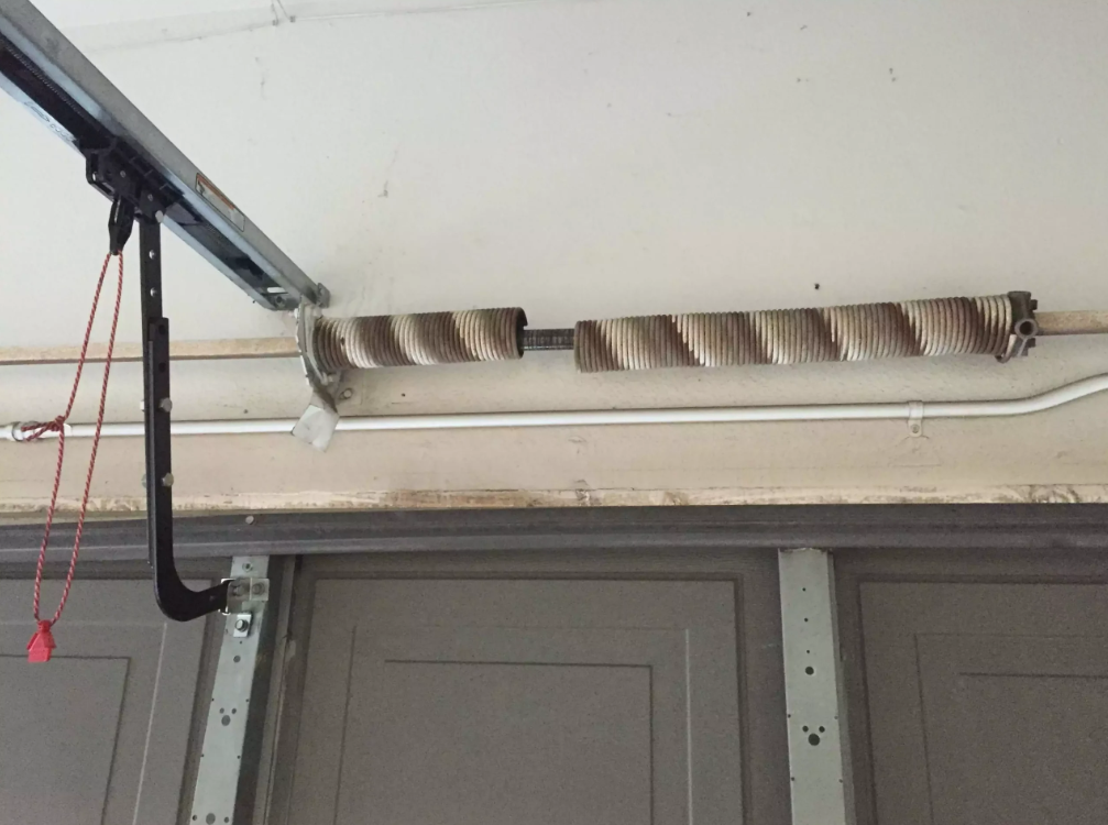 Why New Construction Homes Often Need Early Garage Door Spring Repair